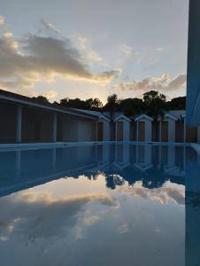 a reflection of the sky in a pool of water at Bardo INN Hotel in Granada