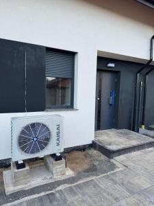a fan is sitting outside of a building at Perła pod Śnieżką in Miłków