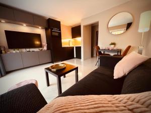 a living room with a couch and a dining room at Valparaíso Apartments Flamingo in San Bartolomé