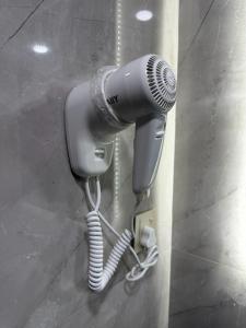 a blow dryer is attached to a wall at Hasan Zawaideh luxury camp 2 in Disah