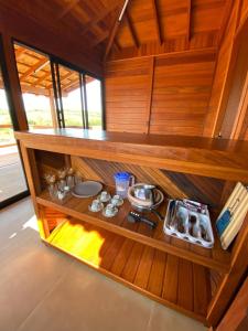 a kitchen with a counter with food on it at Cerrado da Canastra Chalés in São Roque de Minas