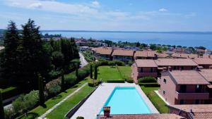 an aerial view of a villa with a swimming pool at Mahatma Residence lake View in Lazise