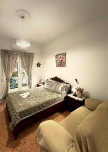 a bedroom with two beds and a window at Mytilene Heritage Loft 3A2 in Mytilene