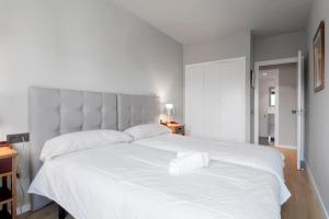 Łóżko lub łóżka w pokoju w obiekcie Luxury II - Vive el Lujo con Elegancia y Diseño