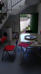 a room with a table and chairs with a plate on it at Buonavacanza in Erice +9 photos