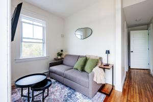 a living room with a couch and a table at Little Banook B&B in Halifax