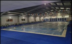 a large swimming pool with two balls in it at 477 California Sands Chalets in Scratby