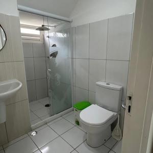 a bathroom with a shower and a toilet and a sink at Casa Jauá ParaisodePainho in Camaçari +45 photos