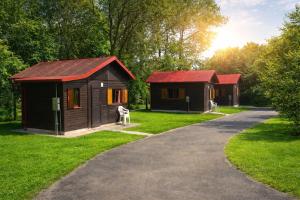 two small cabins on the side of a road at Autocamp Kosmonosy in Mladá Boleslav
