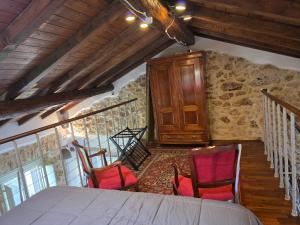 a room with chairs and a table in a building at Loft Naevio in Ferentino