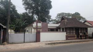a house on the side of a street at Le Stories Heritage Home in Kottayam