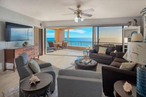 a living room with a view of the ocean at Beachfront Oasis at Sonoran Spa E201 in Puerto Peñasco