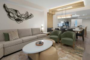a living room with a couch and a table at Marriott's Imperial Palms Villas in Orlando