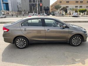 a silver car parked in a parking lot at private car in cairo in Asyut