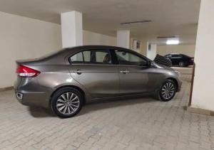 a silver car parked in a parking lot at private car in cairo in Asyut