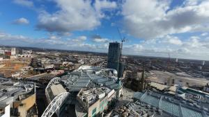 an aerial view of a city with a tall building at Nirbhao in Birmingham