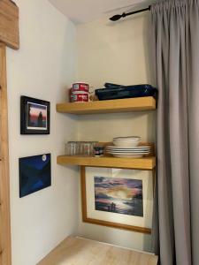 a corner of a room with shelves and a curtain at Sea 'N' Stars BNB in Gabriola +59 photos