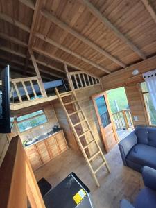a room with two bunk beds and a couch at Cabañas Buenos aires in Guadalupe