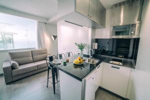 a kitchen with a counter with a bowl of fruit on it at Mannix Urban Apartments in Las Palmas de Gran Canaria