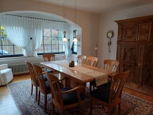 a dining room with a table and chairs at ZusammenZeit in Schleiden - inklusive Sauna, Garage, großer Terrasse und 3 Schlafzimmer - ideal für Familien und Freunde - Hunde freundlich in Schleiden