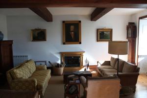a living room with a couch and a fireplace at Casa de Nossa Senhora da Piedade in Ponte de Lima