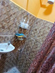 a bathroom with a sink and a shower curtain at EMME Escape in Victoria +4 photos