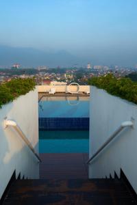 A balcony or terrace at Ascent Hotel & Cafe Malang