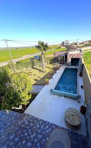an overhead view of a swimming pool on top of a house at DreamCatcher Paragliders in Tamelalt