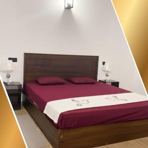 a bedroom with a large red bed with two night stands at Nuwan Home Vacation Villa in Wennappuwa