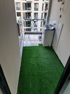 a hallway with green flooring in a building at Lyon in Nairobi