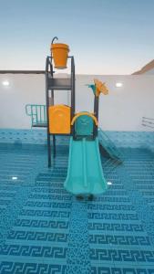 a chair sitting on the floor of a swimming pool at شاليهات تولين 2 in Taif