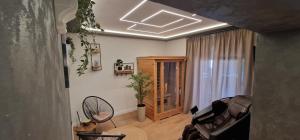 a living room with a couch and a window at Villa Todi with private heated pool & wellness in Zadar
