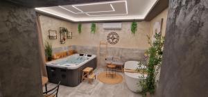 a bathroom with a bath tub and a sink at Villa Todi with private heated pool & wellness in Zadar