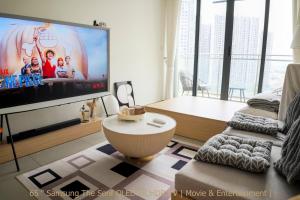 a living room with a flat screen tv and a couch at Minimalist Living , One bedroom in Phnom Penh