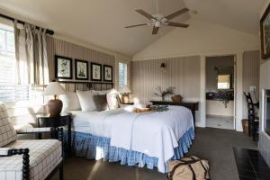 a bedroom with a bed and a ceiling fan at Orchard Hill in Julian
