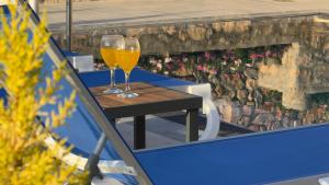 a table with two glasses of wine on a boat at Villa Aden in Fethiye