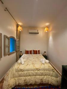a bedroom with a large bed in a room at Hotel & Riad Celia in Marrakesh