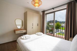 a bedroom with a bed and a large window at Villa Karya in Dalyan +55 photos