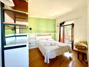 a bedroom with a bed in a room with green walls at Oasi in Poggio Moiano +21 photos