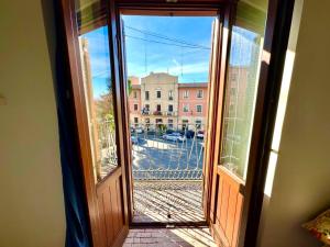 an open door with a view of a street at Oasi in Poggio Moiano