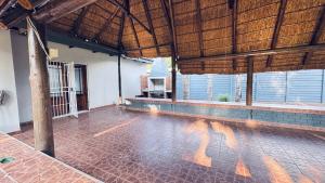a room with a tile floor and a building with windows at Casa Tranquila Luxe in Pretoria