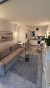 a living room with a couch and a table at Apartamento Dulce & Saladar Calpe in Calpe