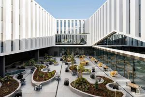 a rendering of the lobby of a building at Moxy Alfragide Lisboa in Alfragide
