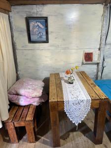 a wooden table and a bench in a room at Las calandrias in Barrio Copacabana +38 photos