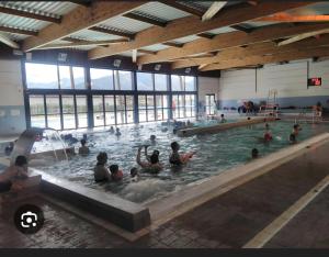 a group of people swimming in a swimming pool at Zalicarté in Saint-Jean-Pied-de-Port