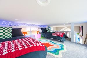 a childrens bedroom with two beds and a rug at Rainforest Tiny Home Retreat #17 Abstract Modern in Forks