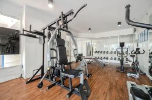 a gym with several exercise bikes in a room at Breezy 1BR Near BTS Udomsuk in Amphoe Phra Khanong