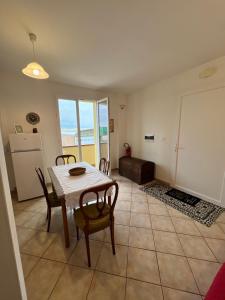 a kitchen and dining room with a table and chairs at Mordano Apartment - ampio appartamento SELF CHECK-IN vicino a Imola in Mordano