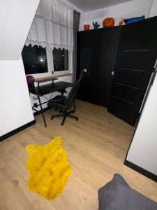 a living room with a yellow rug on the floor at S Golf Apartament in Gowinko