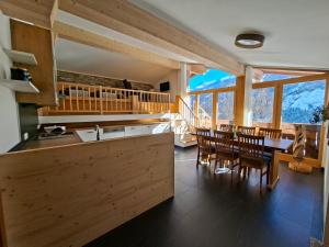 a kitchen and dining room with a table and chairs at Leitingerhof in Virgen +38 photos